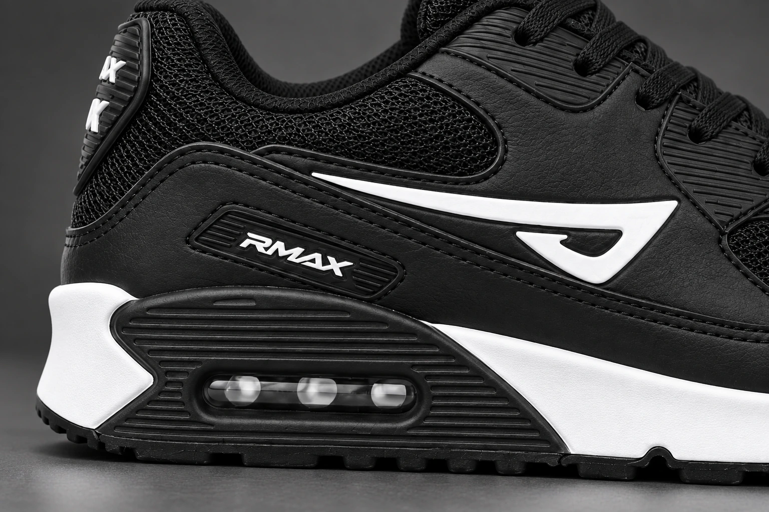 Calcanhar do Air RMax 90 Preto Branco, com a moldura preta e a cápsula Air em destaque